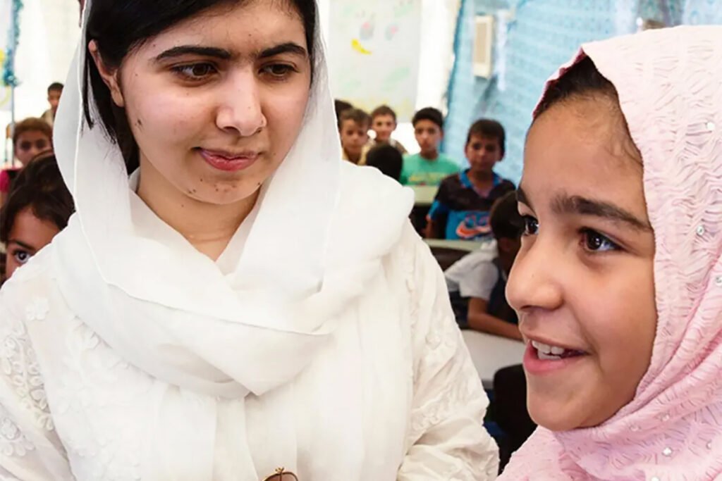 Malala and young student in school