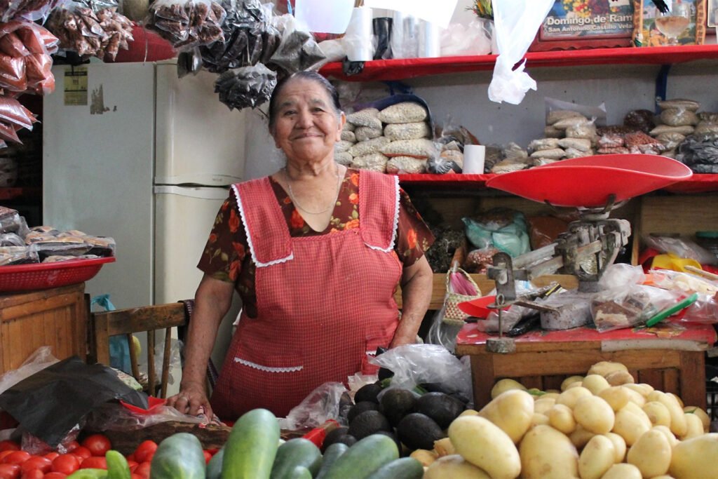 Woman in shop in poor country