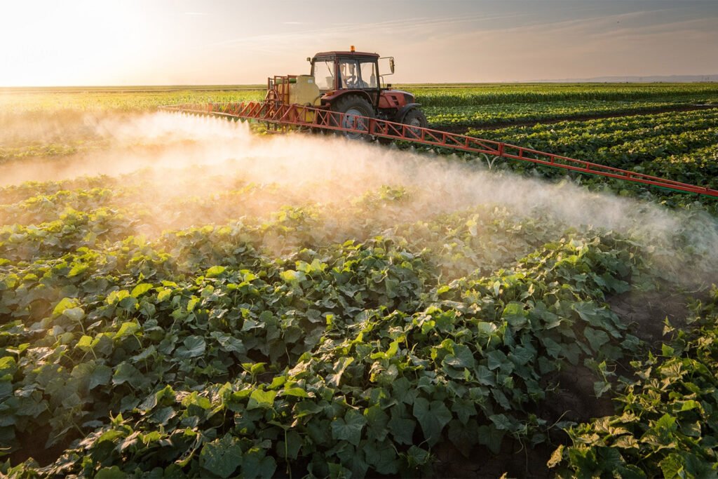 Farm tractor spraying pesticides