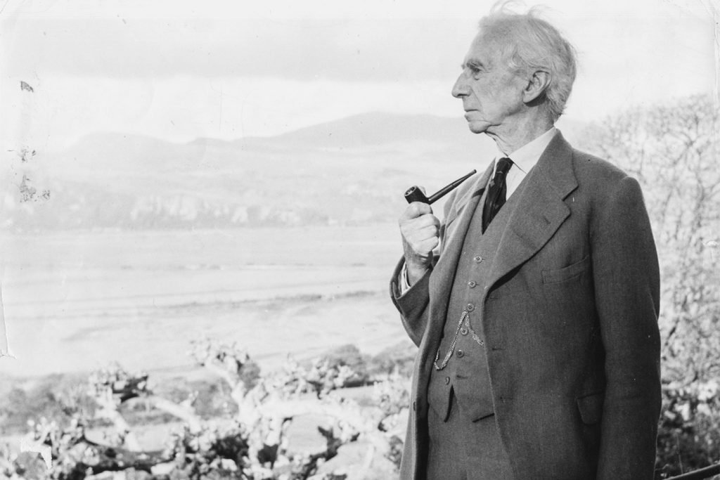 Bertrand Russel smoking pipe looking into distance